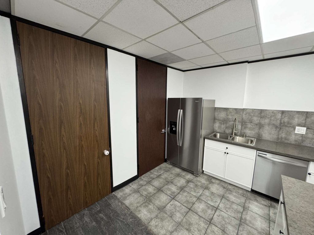 A modern commercial building break room and kitchen