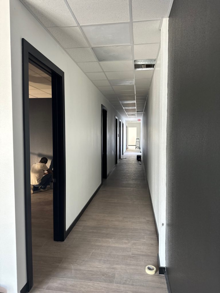 A view down a long building hallway